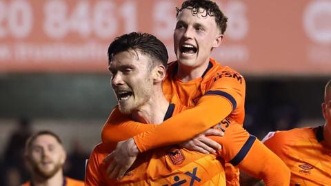 Kieffer Moore celebrates his goal with Nathan Broadhead