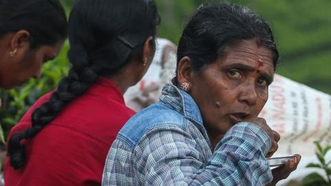 Workers eat at a tea plantation in Sri Lanka.