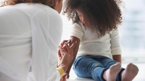 Child being vaccinated