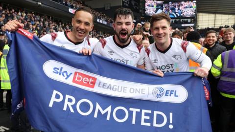 Derby players celebrate winning promotion to the Championship