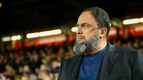 Nottingham Forest owner Evangelos Marinakis watches his club in action at the City Ground