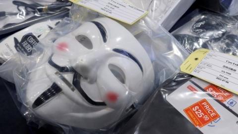 A Guy Fawkes mask is seen at a media conference given by Hong Kong police