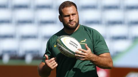 Thomas du Toit holds the rugby ball during a training session with South Africa this summer