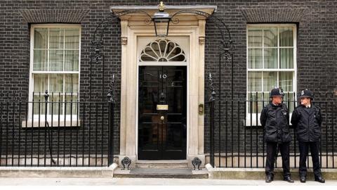 Two police officers stand outside No 10 Downing Street