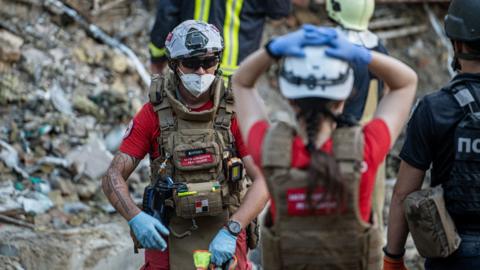 Rescue and military forces clear the rubble of the destroyed building of Ohmatdyt Children's Hospital following a missile strike in Kyiv capital of Ukraine on July 8, 2024.