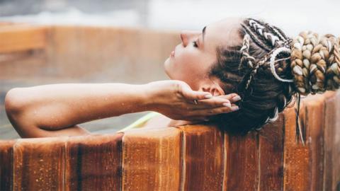 Lady relaxing in a hot tub