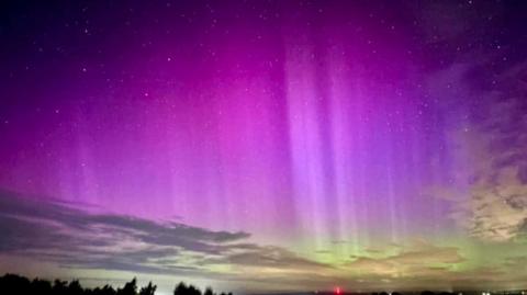 A deep purple and green sky over Ruardean Hill in the Forest of Dean