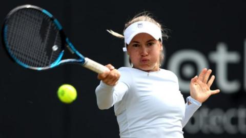 Putintseva hitting the ball