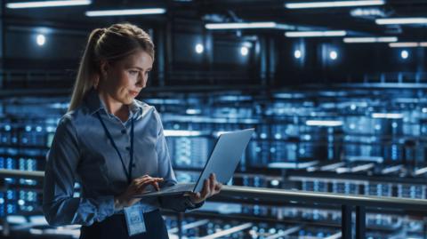 Stock shot of worker in a data centre