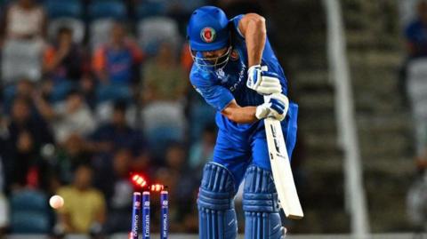 Afghanistan's Gulbadin Naib is bowled during T20 World Cup semi-final against South Africa