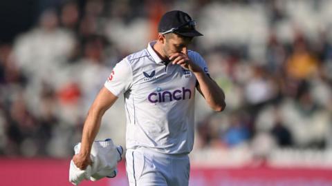 Mark Wood leaving the field with an injury