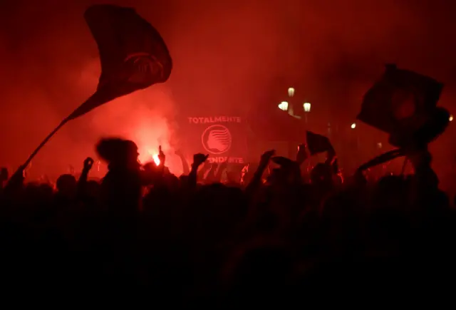 Fans celebrate with flares in bergamo