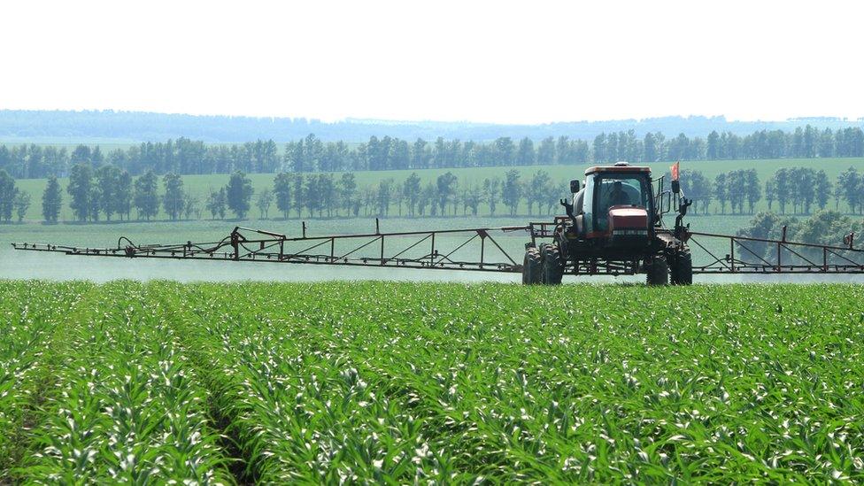 farm machinery sprays fertiliser