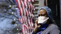 A woman outside a hospital