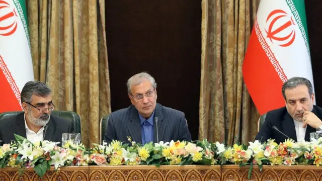 Behrouz Kamalvandi, left, Ali Rabiei, centre, and Abbas Araqchi, right, address the press