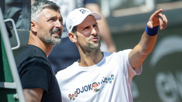 Novak Djokovic of Serbia with coach Goran Ivanisevic during practice