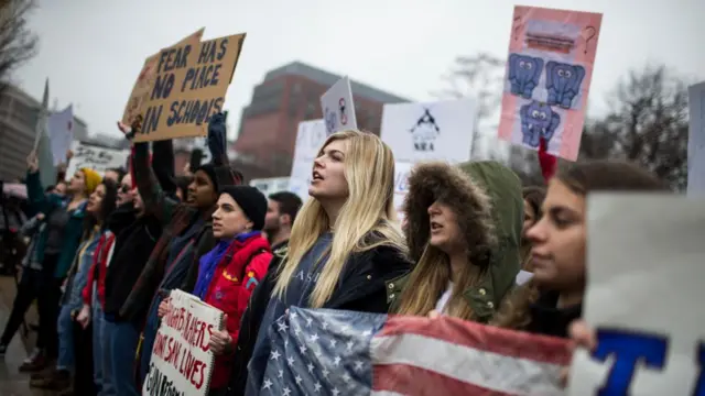 Demonstrators chant during a 'lie-in' demonstration supporting gun control reform near the White House on February 19, 2018 in Washington, DC. According to a statement from the White House, 'the President is supportive of efforts to improve the Federal background check system.', in the wake of last weeks shooting at a high school in Parkland, Florida