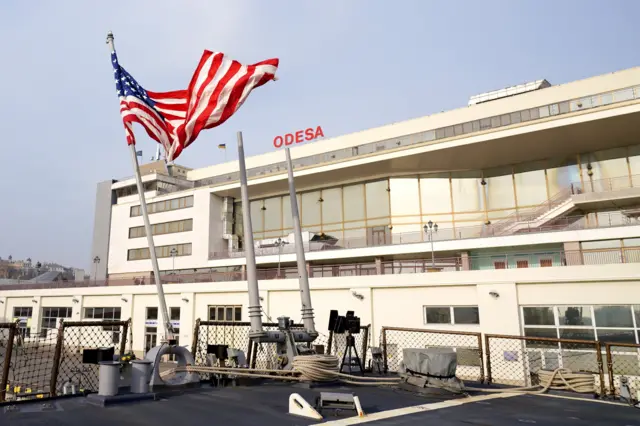 The US national flag hoisted aboard the USS Donald Cook (DDG-75) Arleigh Burke-class guided missile destroyer is seen at the Odessa Sea Port