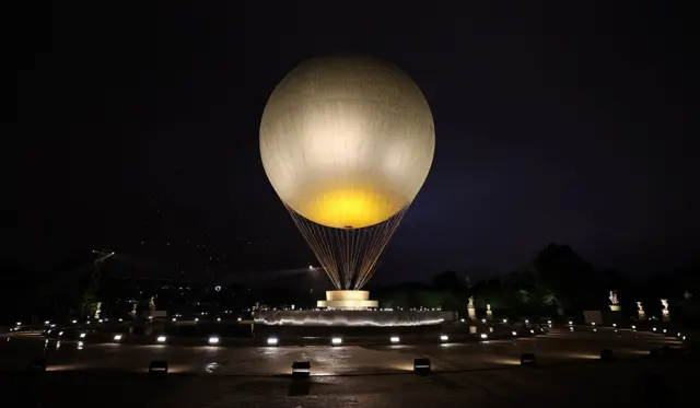 A view shows the large cauldron balloon at Jardin des Tuileries before it was lit on the day of the opening ceremony.