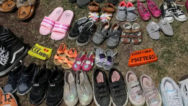 In recent weeks, people have placed children's shoes at memorials to mourn those who died