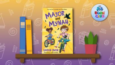 The book 'Major and Mynah' sits on a illustrated shelf.