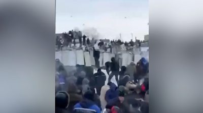 Protesters throwing snowballs at police in Russia