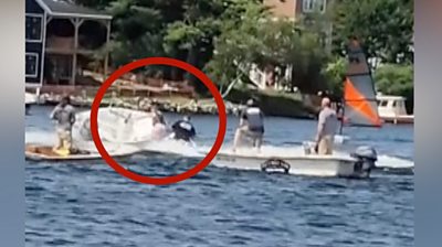 Red circle around teenager jumping on a boat