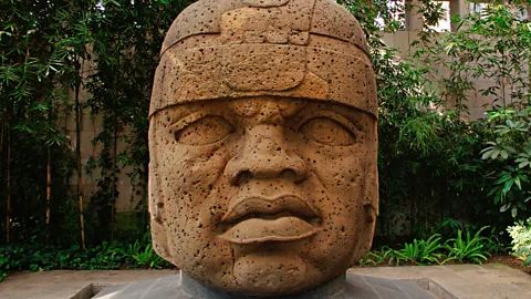 A large Olmec stone head on display in Mexico.