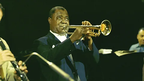Louis Armstrong blowing trumpet at BBC Television Centre (colour) (Credit: Getty Images)