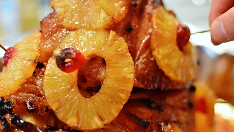 Image Kit/Getty Images Pineapple’s sweetness has often been seen as a foil for the saltiness of cured ham (Credit: Image Kit/Getty Images)