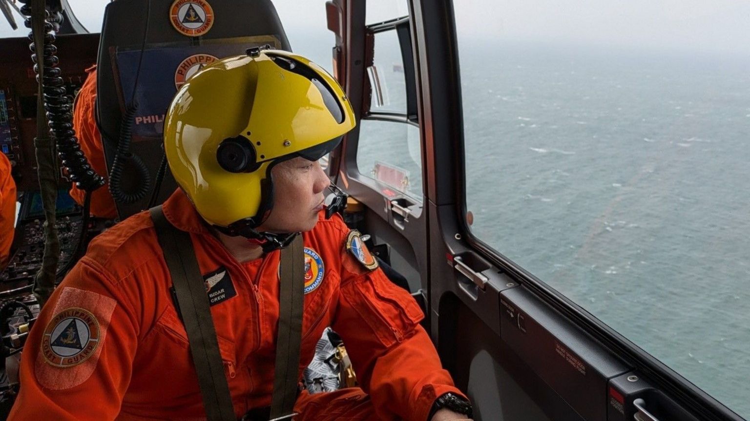 A Philippine Coast Guard handout photo shows the coastguard searching for a capsized tanker