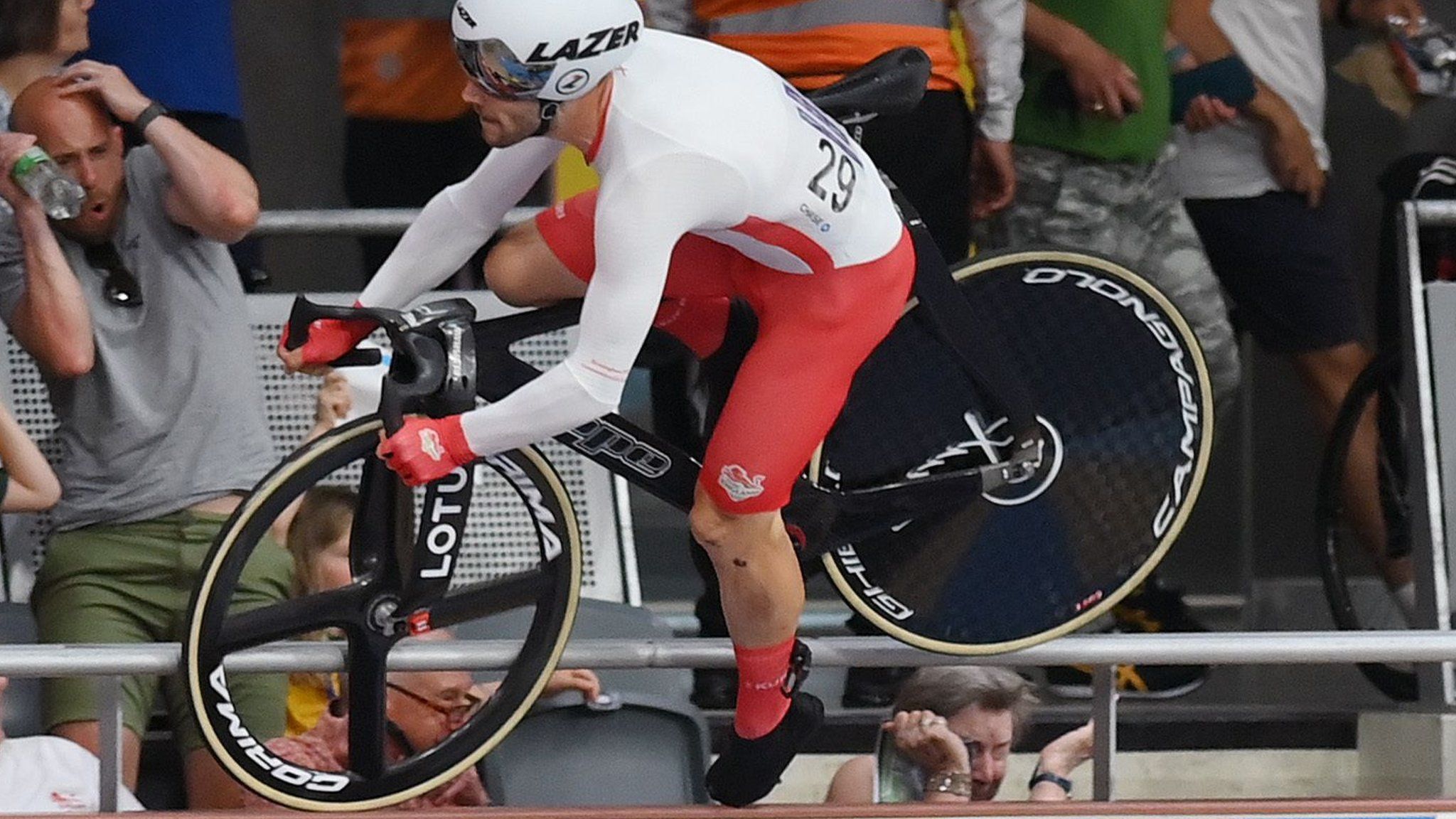 Team England cyclist Matt Walls crashes over the barriers and into the crowd at the velodrome during the Commonwealth Games