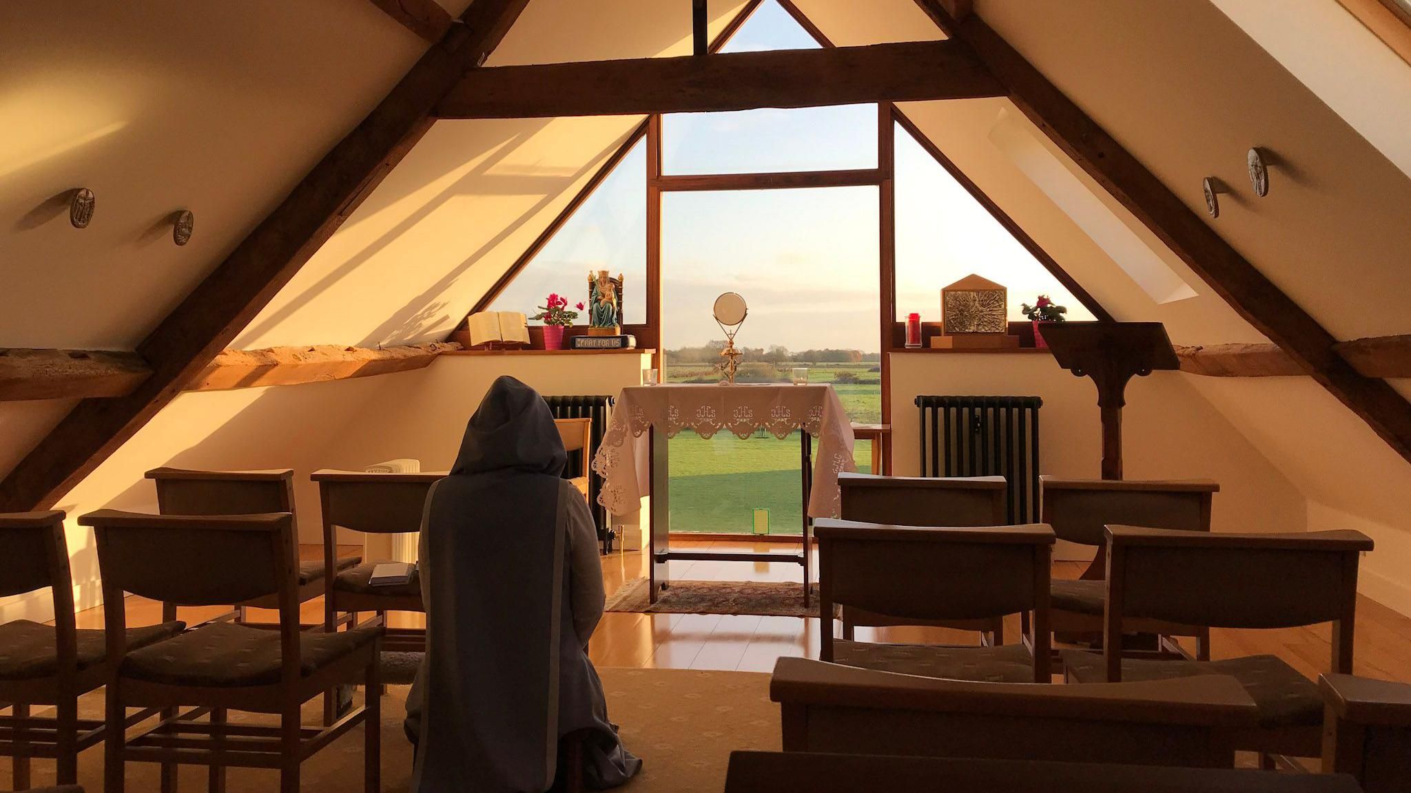 A sister praying in the convent chapel