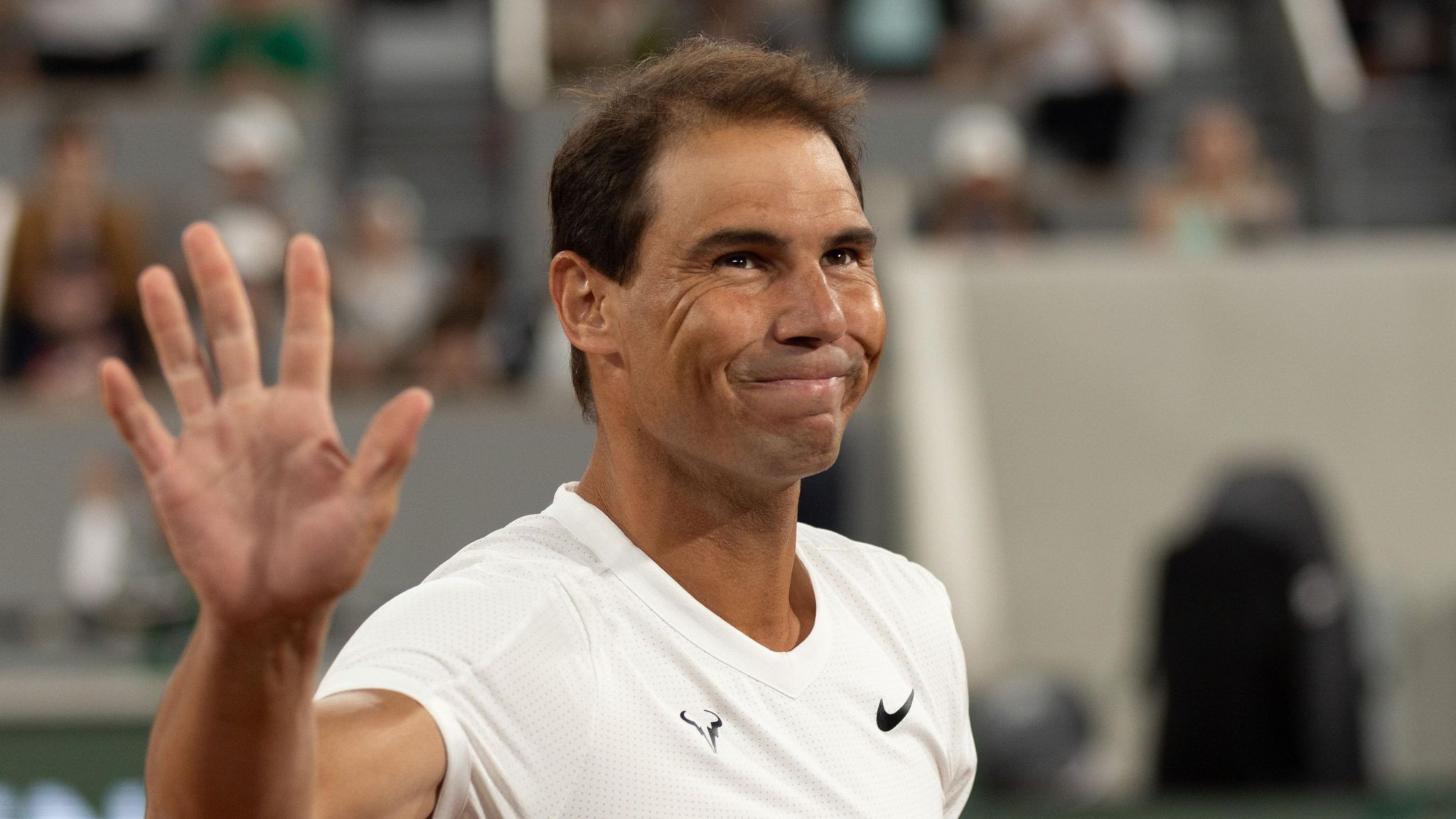Rafael Nadal waves at fans during the 2024 French Open