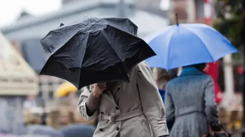 Woman holding umbrella