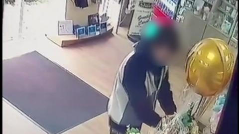 CCTV showing a man stealing from the shop