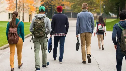 Getty Images Students walking away from camera