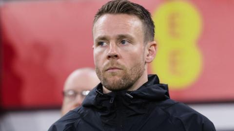Chris Gunter on the touchline as a member of Wales' management team
