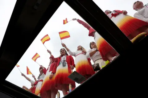  Violeta Santos Moura/Reuters Athletes from Team Spain wave Spanish flags during the opening ceremony