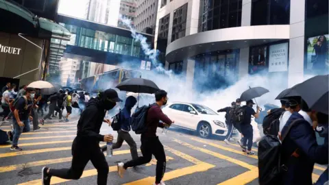 Reuters Protesters running from tear gas in central Hong Kong