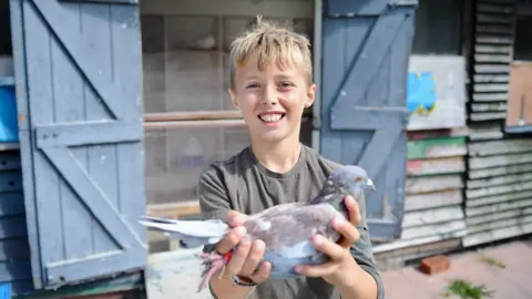 Harry with one of his pigeons