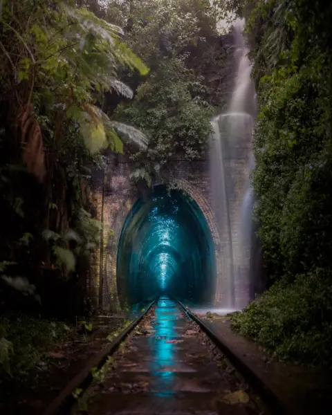 Josselin Coronou / Nature TTL Glow worms illuminate a railway arch in Helensburg, Australia.