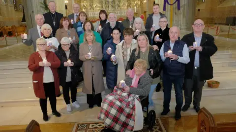 Liam McArdle Mr Martin with members of the congregation for the annual Mass for the Disappeared