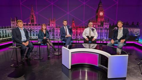 The candidates sit in the studio