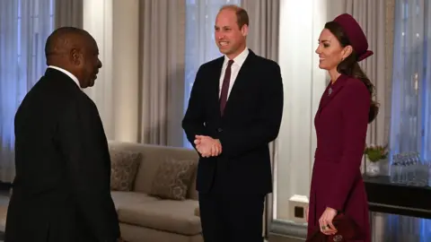 Cyril Ramaphosa with a smiling Prince and Princess of Wales.