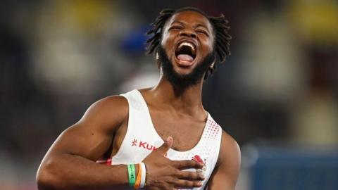 Emmanuel Oyinbo-Coker celebrating winning gold at the Commonwealth Games in Birmingham