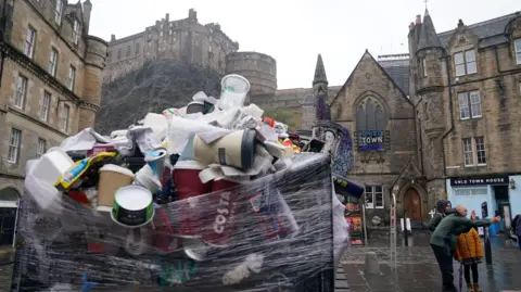 An overflowing bin in the Grassmarket