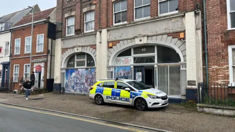 Andrew Turner/BBC A police car outside a property on King Street, Great Yarmouth