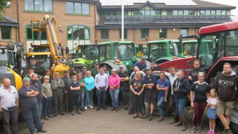Carmelo Garcia Farmers stood by their tractors at the Forest of Dean District Council offices in Coleford