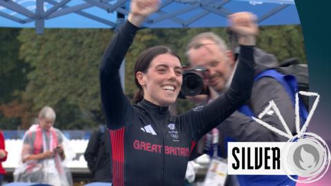 Anna Henderson celebrating her Silver medal in the cycling time trials